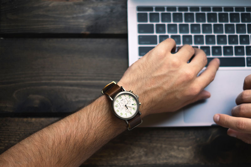 Productivity Image - Man working on mac with watch